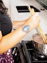 Person cooks traditional Navajo food.